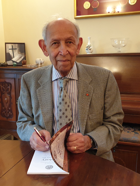 John Barrie signing a copy of the Society's history