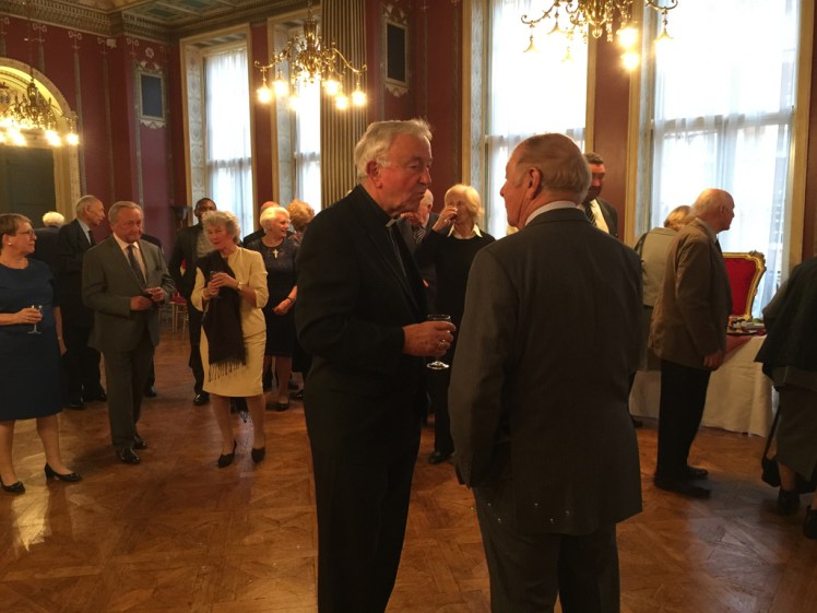 Cardinal speaking to guest